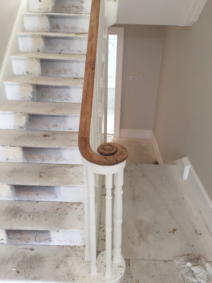 Stripped and painted balustrade and freshly stripped handrail in a by Impressions Painters and Decorators in Ranelagh