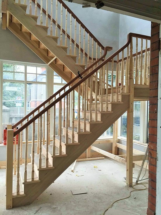 Before photo - how to paint a newly built staircase - start with primer
