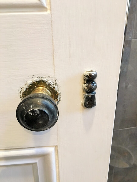 A doorknob on a period door in Terenure prior to being restored by Impressions painting and decorating