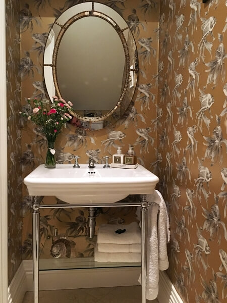 Decorated and wallpapered bathroom by Impressions Painters and Expert Wallpaper Hanger and Decorating