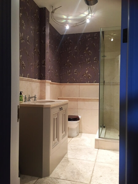 Hand painted bathroom wallpapered and painted bathroom cabinet by Impressions bathroom painters Dublin