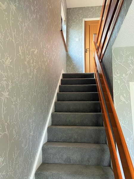 Painted and decorated hall stairs and landing in Shankill Dublin by Impressions painting and decorating expert wallpaper installers near me