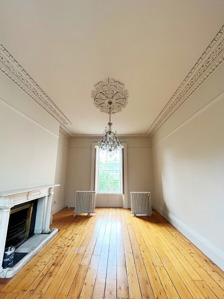 Period living room, ceiling rose, cornicing after being restored by period house Impressions expert Painters and Decorators in Monkstown