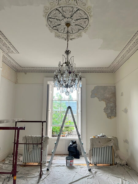 Period living room, ceiling rose, cornicing before being restored by period house Impressions expert Painters and Decorators in Monkstown