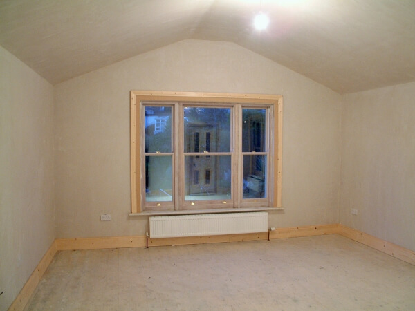 Raw plaster and woodwork childrens nursery before being painted by Impressions Painters and Decorators Dublin