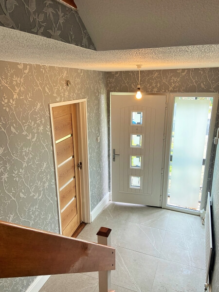 Wallpapered and painted halls stairs and landing by Impresisons halls stairs and landing painters in Dublin