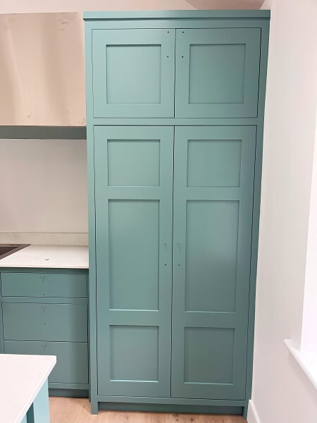Kitchen cabinet after being hand painted by Impressions Painting and Decorating