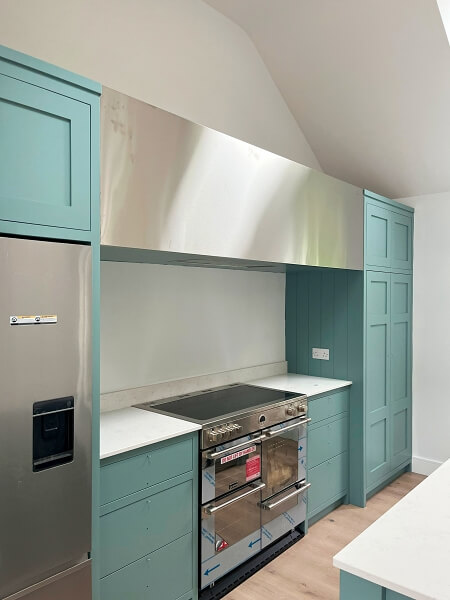 Kitchen cabinet unit after being hand painted by Impressions Painting and Decorating