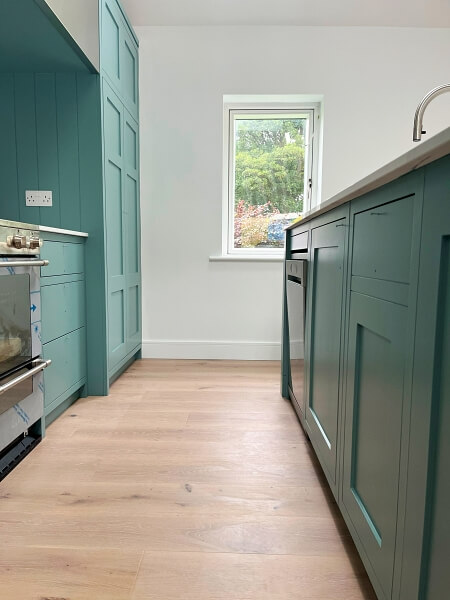 Kitchen cupboards after being hand painted by Impressions Painting and Decorating