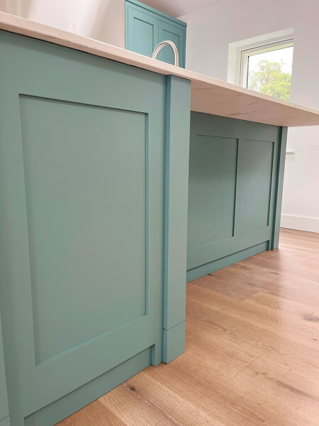 Kitchen island after being hand painted by Impressions Painting and Decorating