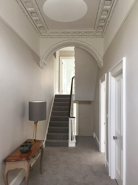 A hall, stairs, and landing in a period home in Ranelagh after being painted by Impressions Painting and Decorators