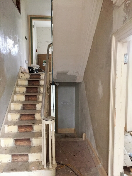 A hall, stairs, and landing in a period home in Ranelagh before being painted by Impressions Painting and Decorators