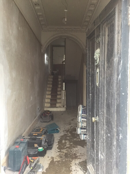 A hall, stairs, landing and Georgian door in a period home in Ranelagh before being painted by Impressions Painting and Decorators